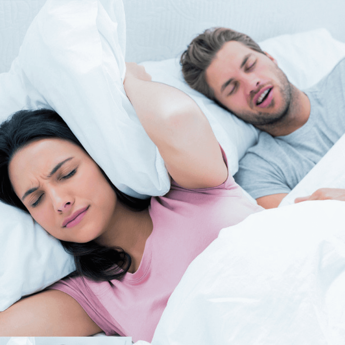 A woman annoyed by her husband's snoring