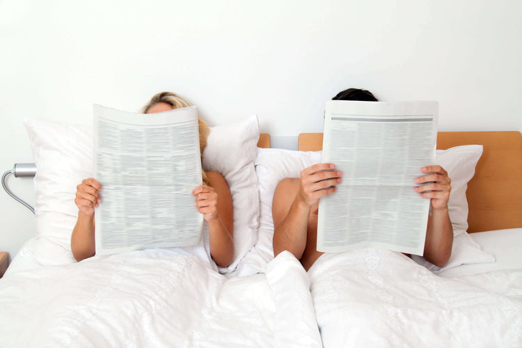 People reading newspaper articles about Back2Sleep