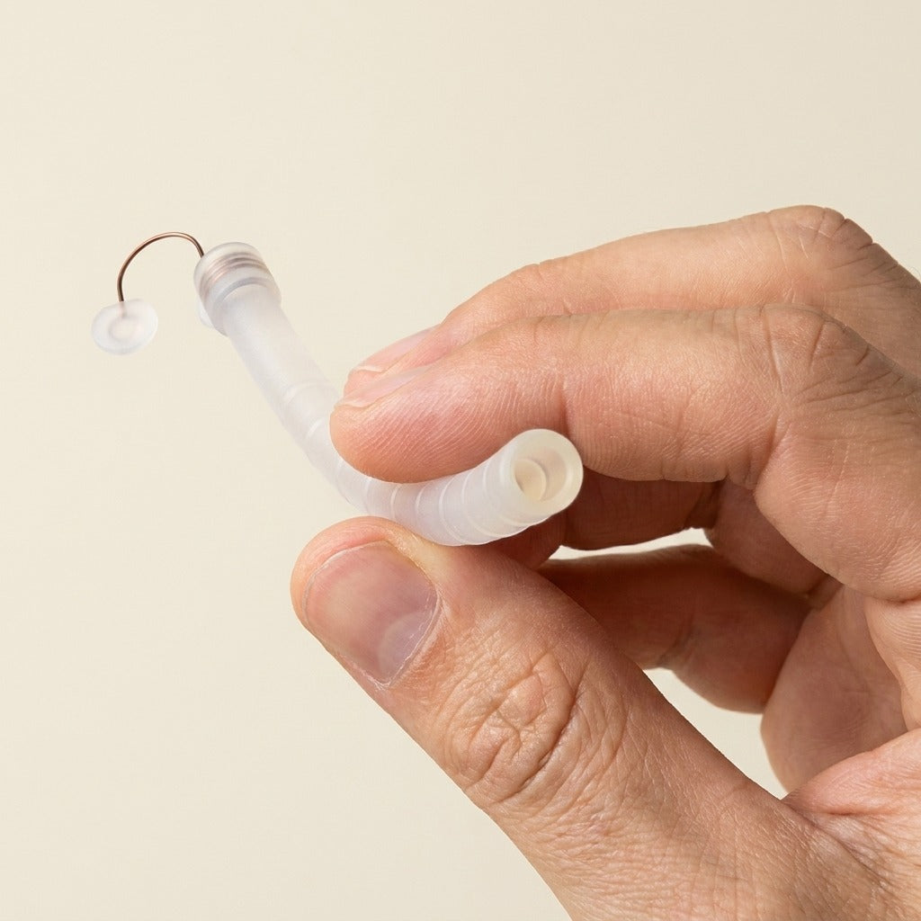 Back2Sleep nasal stent gently held between thumb and forefinger