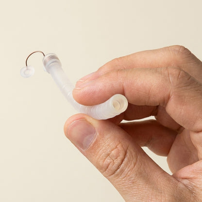 Back2Sleep nasal stent gently held between thumb and forefinger