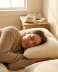 Adult sleeping peacefully at dawn — Back2Sleep sachet on the bedside table